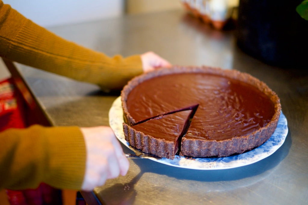 Pulling out a slice of the chocolate lavender tart to eat