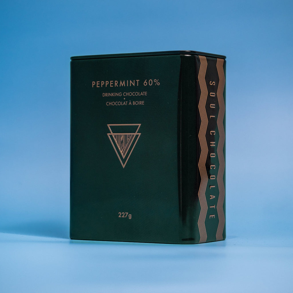 A green tin of minty peppermint hot chocolate powder mix
